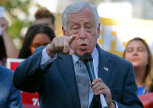 Steny Hoyer Pointing Intently At A Political Event Wallpaper