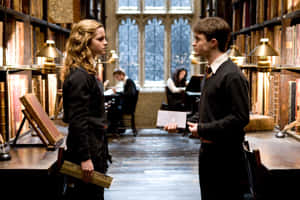 Step Inside The Famous Library Of Hogwarts, A Magical World Of Knowledge For Witches And Wizards. Wallpaper