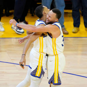 Steph Curry Chest Bumps Jordan Poole Wallpaper