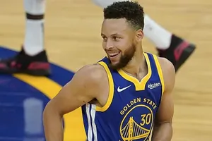 Steph Curry Smiling And Looking At Side Wallpaper
