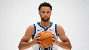 Stephen Curry 4k Holding Basketball With Both Hands Wallpaper