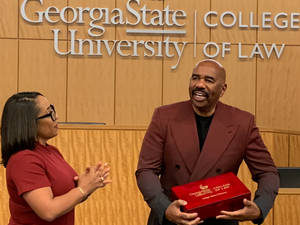 Steve Harvey Wearing A Brown Coat Wallpaper