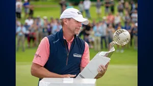 Steve Stricker Admiring A Trophy Wallpaper