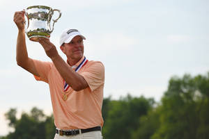 Steve Stricker Raising Silver Trophy Wallpaper