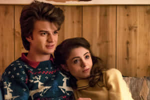 Steveand Nancy Stranger Things Couch Scene Wallpaper