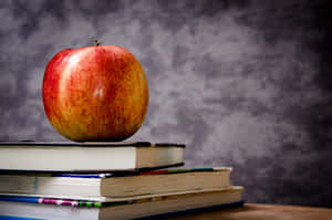 Still Apple On Top Of Books Wallpaper