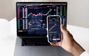 Stock Market Analysis Handheldand Laptop Wallpaper