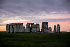 Stonehenge Under The Pastel Purple Clouds Wallpaper