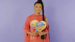 Storm Reid Holding Emoji Props Wallpaper