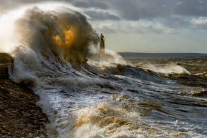 Storm Waves Near Lighthouse Wallpaper