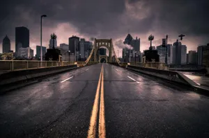 Stormy Cityscape Bridge View Wallpaper