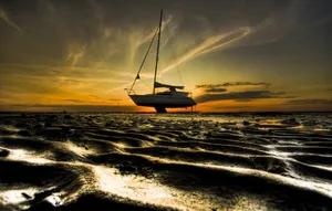 Stranded Boat At Low Tide Wallpaper