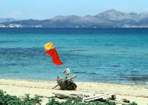 Stranded Boat With Red Flag Wallpaper