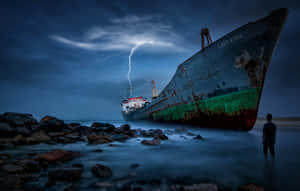 Stranded Person From Broken Ship Wallpaper
