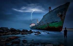 Stranded Person From Broken Ship Wallpaper