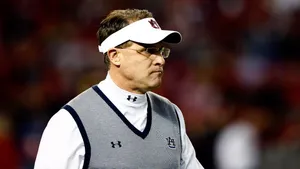 Strategic Football Coach On The Field Wallpaper