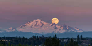 Strawberry Moon Over Mountain Peaks Wallpaper