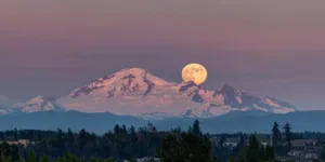 Strawberry Moon Over Mountain Peaks Wallpaper