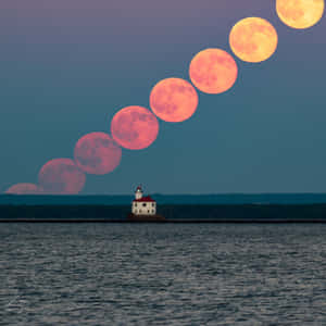 Strawberry Moon Sequence Lighthouse Wallpaper