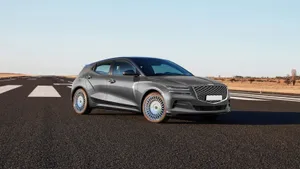 Striking And Stylish Genesis Gv60 On The Road Wallpaper