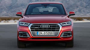 Striking Audi Q5 On Scenic Road Wallpaper