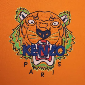 Striking Embroidered Kenzo Tiger In Vibrant Orange Wallpaper