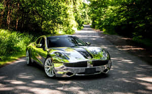 Striking Fisker Electric Vehicle On A Scenic Road Wallpaper