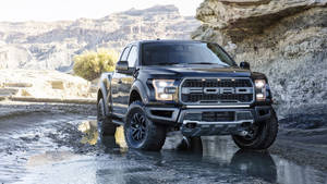 Striking Ford Raptor In Polished Black Finish Wallpaper