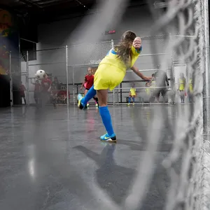 Striking Moment In Indoor Soccer Wallpaper