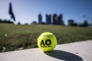 Striking Neon Green Tennis Ball At The Australian Open Wallpaper