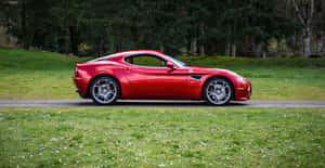 Striking Red Alfa Romeo 8c Competizione In Motion Wallpaper