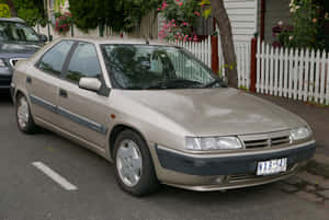 Striking Red Citroen Xantia In Natural Scenery Wallpaper