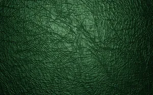 Striking Shimmer Of A Green Leather Texture Wallpaper