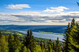 Striking Sunrise Over Snowy Lillehammer Wallpaper