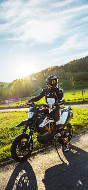 Striking View Of Ktm Dirt Bike In Action Wallpaper