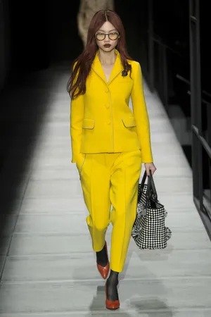 Striking Yellow Outfit On Fashion Model Wallpaper