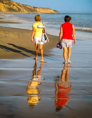 Strolling Along The Serene Beach Wallpaper