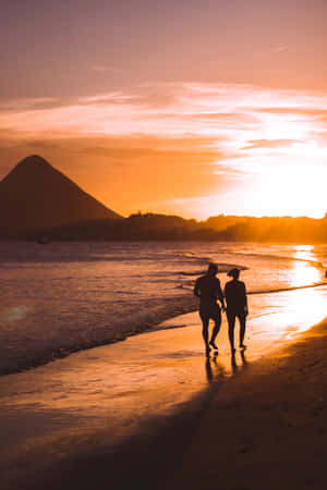 Strolling Along The Serene Beach Shoreline Wallpaper