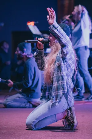 Strong Worship Leader Singing Passionately Wallpaper