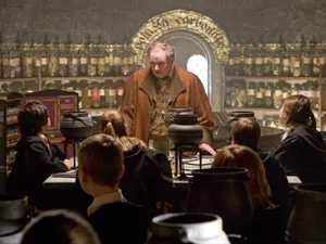 Students Developing Their Skills At The Hogwarts Potions Class Wallpaper