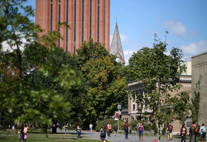 Students Strolling Across The University Of Massachusetts Campus Wallpaper