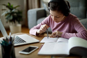 Studious Girl Wearing Headphones Wallpaper