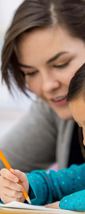 Studious Girl With Teacher Wallpaper