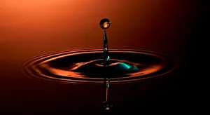 Stunning 3d Water Splash On A Serene Ocean Surface Wallpaper