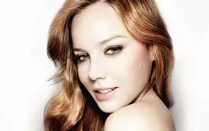 Stunning Abbie Cornish Posing In A Breathtaking Red Outfit Wallpaper