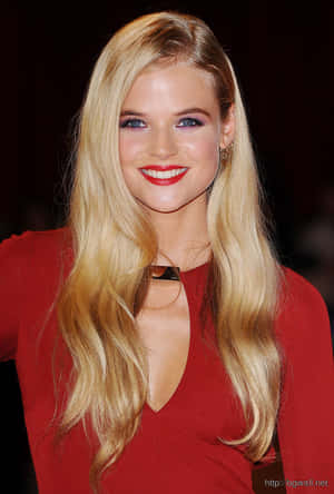 Stunning Actress Gabriella Wilde In An Elegant Red Dress Wallpaper