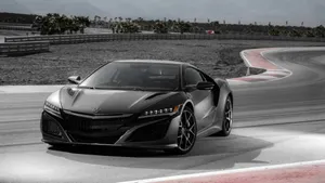 Stunning Acura Nsx In Motion On The Open Road Wallpaper