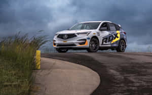 Stunning Acura Rdx On Scenic Road Wallpaper