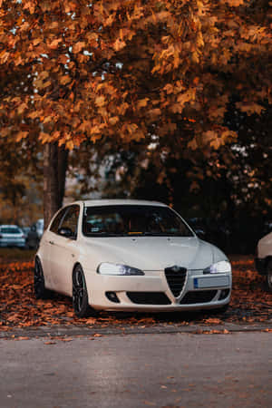 Stunning Alfa Romeo 147 In A Scenic Landscape Wallpaper