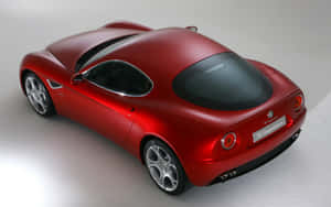 Stunning Alfa Romeo 8c Competizione In Vibrant Red Wallpaper